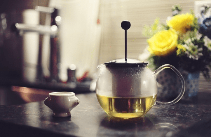teapot-and-flowers-on-table-foter
